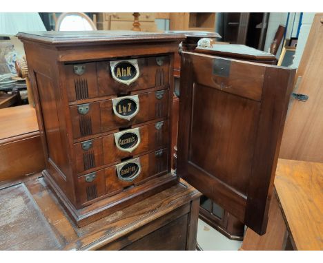 A Victorian Amberg's patent Index Filing cabinet with original card index files to each of the 4 drawers marked A - K and L -