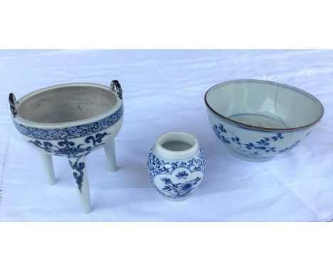A Chinese blue and white ceramic censor stand with loop handle decoration, height 11cm; a Chinese blue and white rice bowl wi