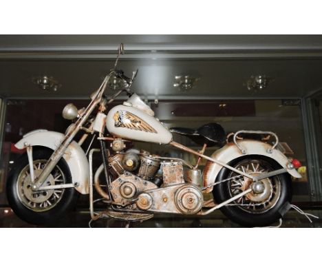 A painted tin model of a vintage Indian motorbike, W. 38cm.