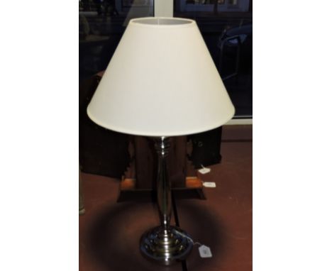 A nickel plated table lamp with cream shade, H. 70cm.