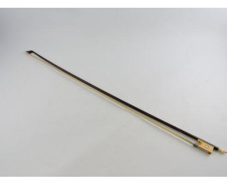 An early 20th century ivorine and mother-of-pearl mounted violin bow, L. 73cm.