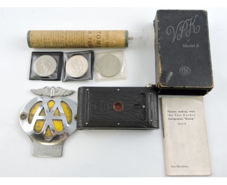 An Automobile Association member's badge circa 1960's-70's, chrome with yellow backing, together with a Kodak vest pocket cam