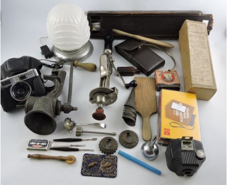 A small quantity of domestic items, including a mincer, Mutt Brown vacuum whisk, Kodak camera, a Rockwell calculator, butter 