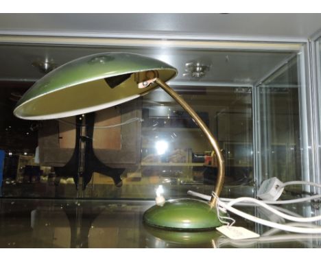 A retro style olive green desk lamp, the disc shade with a brass support, H. 26cm.