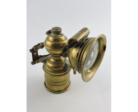 An early 20th century brass acetylene cycle lamp, by Cicca, H. 18cm.