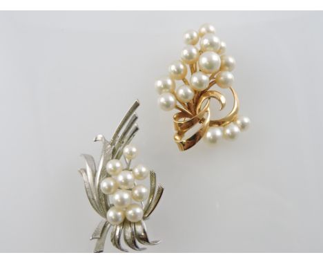 A pearl and yellow metal brooch, stylised foliate design stamped 14k, 15.1g; together with a pearl brooch set in white metal 
