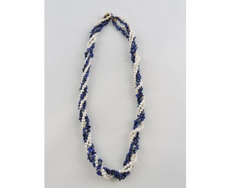 A lapis lazuli and seed pearl ropetwist necklace, with a yellow metal clasp.
