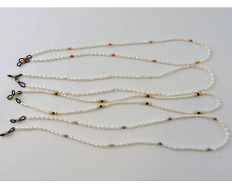 A pearl spectacle chain, interspersed with purple beads; together with three other similar. (4)
