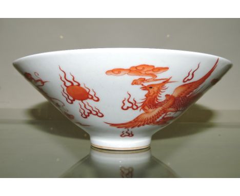 A Chinese porcelain flared pedestal bowl, decorated with a five-clawed dragon and phoenix chasing a pearl, six character Qian