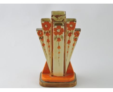 An Art Deco fan shaped stem vase by Myott & Sons Ltd., decorated with bell-flowers with an orange and brown palette on a crea