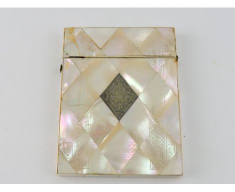A 19th century mother-of-pearl rectangular card case, the diamond shaped panels with engraved decoration and a central cartou