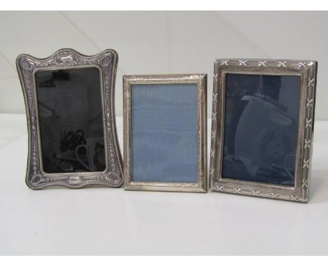 SILVER PHOTO FRAME, collection of 3 silver easel photo frames, 1 with neo classical design surround, 18cm height