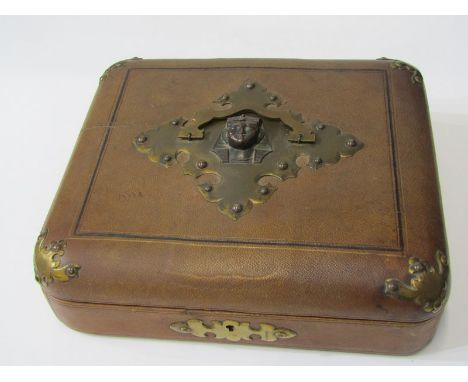 VICTORIAN MOROCCO LEATHER JEWELL CASKET, with applied Egyptian motif brass carrying handle and escutcheon, 28cm width