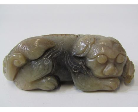 JADE, Chinese carved jade resting temple dog, 10cm length Lot 428: Lacking small section next to head, otherwise in good cond