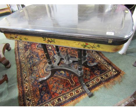 LATE VICTORIAN EBONISED CARD TABLE, gilt ground painted bird and flower frieze on 4 column supports, with blue baize interior
