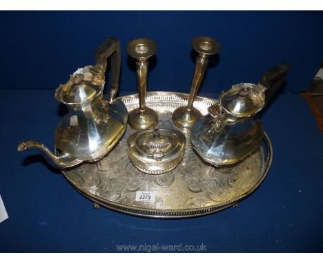 A Silver Teapot, coffee Pot and sugar Bowl, a pair of silver Candlesticks (silver weight 1200 gms. approx.) on a plated galle