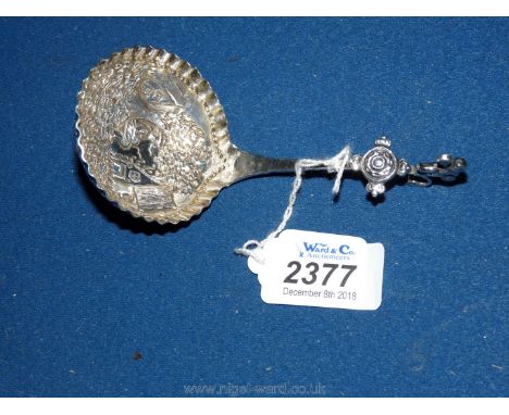 An antique silver Dutch tea caddy spoon very ornate hall marked London Import, early date.