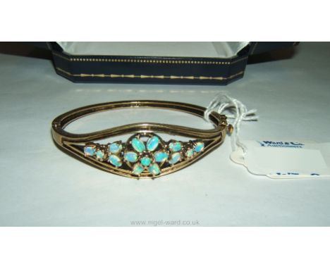 A vintage 14k Gold and Opal set Bangle.