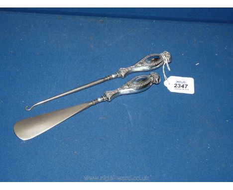 An early 20th C steel Shoehorn and button Hook with silver matching handles, Birmingham 1913 maker C&amp;N