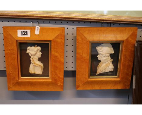 Pair of Walnut framed Wax Relief plaques depicting Nelson and Emma Lady Hamilton by Leslie Ray of London 