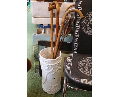 Ceramic blanc de chine umbrella vase with a Shooting Stick and walking sticks 