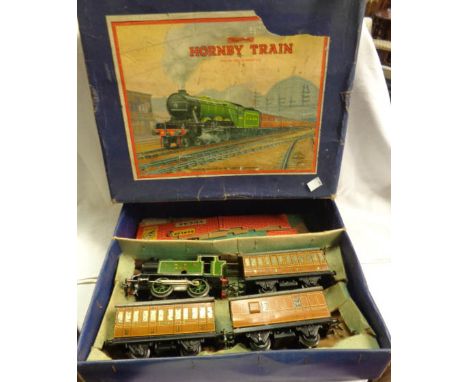 A vintage boxed Hornby O gauge clockwork train set comprising LNER 460 tank engine and three carriages, card layout and bookl