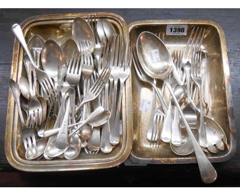 A silver plated entree dish containing assorted silver plated cutlery