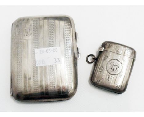 A silver cigarette case with engine turned decoration - sold with a silver vesta case - both bearing initials