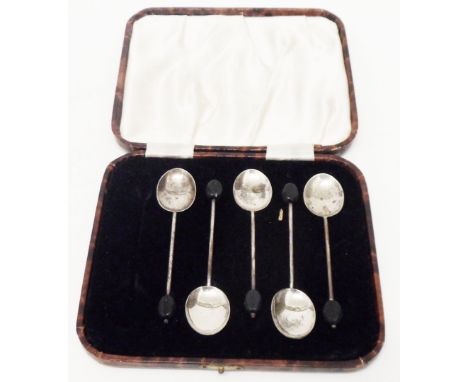 A cased part set of silver coffee bean spoons 