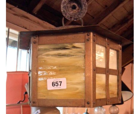 A brass hexagonal lantern with agate glass panels