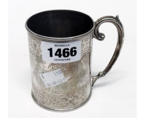 A Victorian silver mug with two bands of engraved decoration and scroll handle - base marks Sheffield 1866