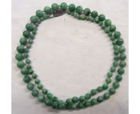 A vintage apple jade graduated bead necklace with marked silver clasp