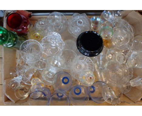 A box containing a large assortment of drinking glasses, vases, coloured decanter, etc.