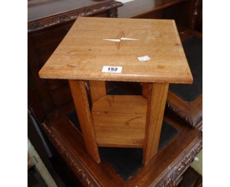 A pair of hardwood two tier bedside tables with compass point inlaid tops and canted corners