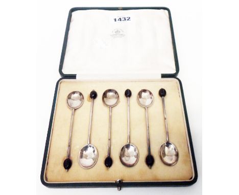 A cased set of six silver coffee bean spoons