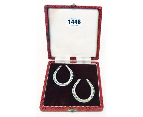 A cased pair of silver horseshoe pattern novelties - Sheffield 1975/81
