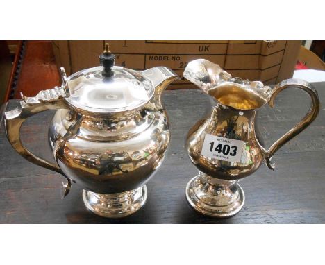 A silver plated hand made bulbous pedestal jug - sold with a hot water jug with flip lid