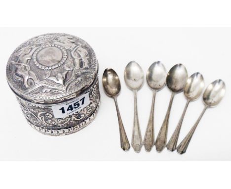 A 3 1/2" diameter Victorian silver box with stylised armorial to push-fit lid and embossed foliate scroll decoration - London