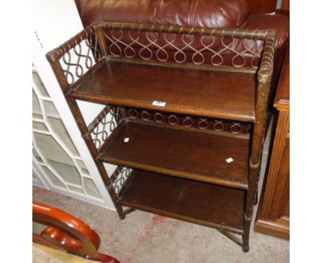 A 25 1/2" stained cane and wood three shelf open bookcase