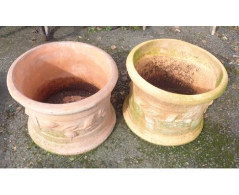 A pair of large terracotta garden pots