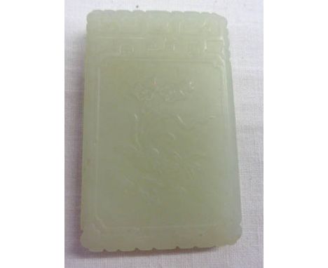 A Chinese carved apple jade pendant