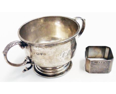 A Chester silver two handled footed trophy bowl bearing initials - sold with a silver napkin ring