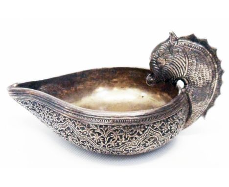 Eastern white metal oil wick lamp with mythological beast pattern handle and profuse decoration