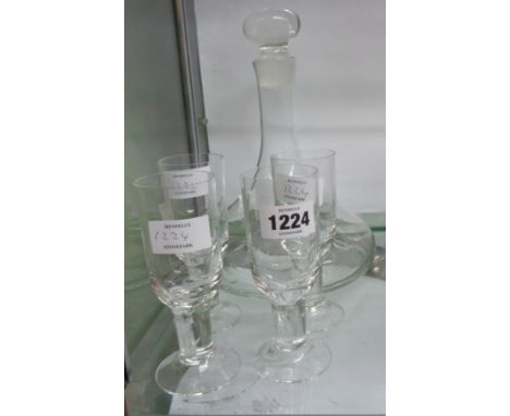 A Dartington glass ship's decanter sold with four Dartington glass Victoria sherry glasses (one chipped)