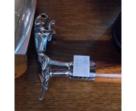 A walking stick with jaguar pattern cast metal handle