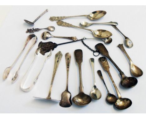 A collection of silver condiment spoons, pair of sugar nips, etc. - various age and makers