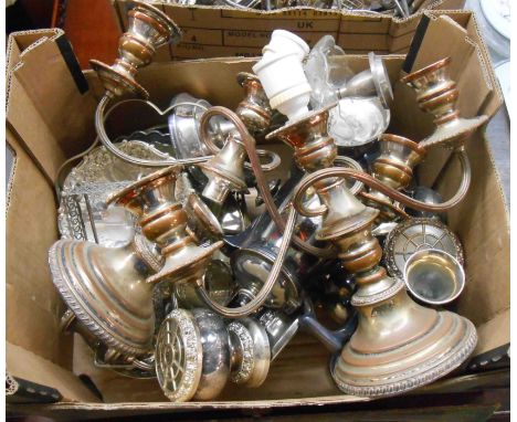 A box containing a quantity of silver plated items including a pair of three branch candelabra, miniature rose bowls, trumpet