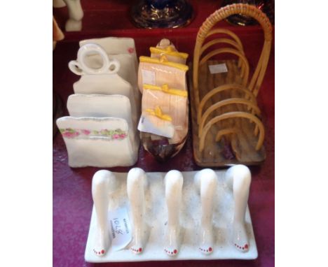 Four toast racks including Carlton Ware legs pattern