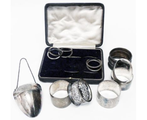 A silver decanter drip pocket - sold with five silver napkin rings, another and menu holders