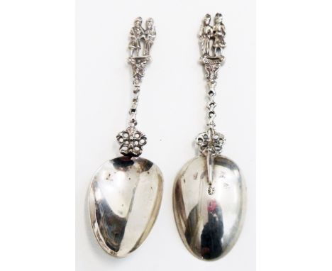 A pair of Dutch silver ornate figural topped spoons with "Fantasy" bowl back marks and pierced stems